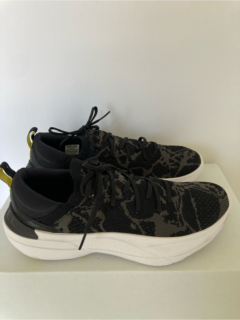 Sorel Explorer Blitz Stride Lace Sneaker Black and white
